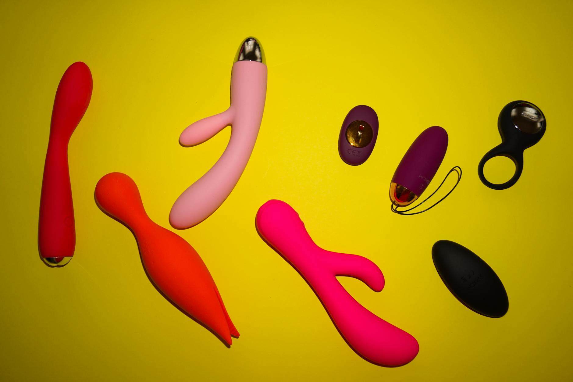 A teal lemon vibrator resting on soft white silk fabric, symbolizing gentleness and recovery